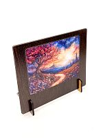 Wooden puzzle with 500 pieces. The magic of nature. A tree among mountains and flowers